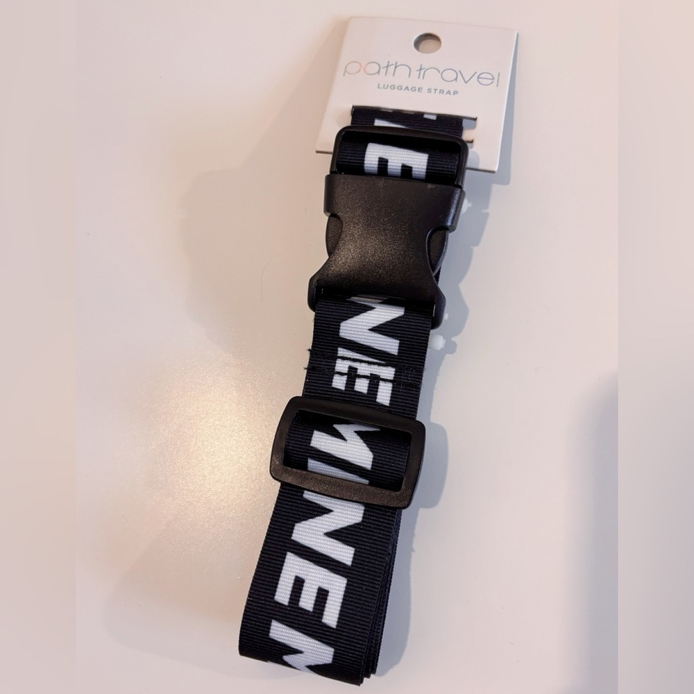 BNWT - Path Travel luggage strap - Black with repeating “MINE” words on strap